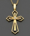 A beautiful take on the classic cross pendant featuring a diamond accent set in intriguing 14k gold openwork. Approximate length: 18 inches. Approximate drop: 3/4 inch.