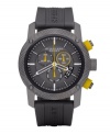 This Burberry timepiece features a gray rubber strap and round stainless steel case. Textured, gray chronograph dial with stick indices, date window at four o'clock, three subdials, logo and white and yellow accents. Quartz movement. Water resistant to 100 meters. Two-year limited warranty.