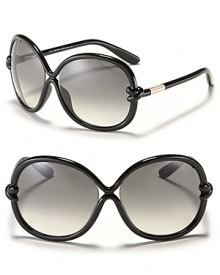 Round oversized sunglasses with streamlined curves and knotted detail at temples for a unique style from Tom Ford. Round oversized sunglasses with streamlined curves and knotted detail at temples for a unique style from Tom Ford.