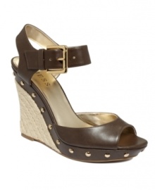 The best of espadrilles and mules meet up on the Tabari2 sandals by GUESS. With bold nail head trim and an espadrille style heel, these wedges are perfect for transitional seasons. The best of espadrilles and mules meet up on the Tabari2 sandals by GUESS. With bold nail head trim and an espadrille style heel, these wedges are perfect for transitional seasons.