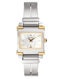 Standout style she'll adore. Silvertone mixed metal bracelet and case with goldtone accents. White mother-of-pearl dial with logo and polished goldtone indicators and stick indexes. Two hands. Quartz movement. Water resistant to 30 meters. Three-year limited warranty. Standout style she'll adore. Silvertone mixed metal bracelet and case with goldtone accents. White mother-of-pearl dial with logo and polished goldtone indicators and stick indexes. Two hands. Quartz movement. Water resistant to 30 meters. Three-year limited warranty.