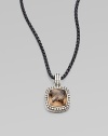From the Moonlight Ice Collection. An enhancer of rich smokey quartz is surrounded by pavé diamonds.Diamonds, 0.45 tcw Smokey Quartz Sterling silver Enhancer width, about ½ ImportedPlease note: Chain sold separately. 