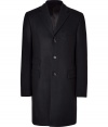 This luxurious coat in a fine, black wool blend is a dream coat for a lifetime - Classic, understand and elegant with a slim, long silhouette - Features traditional lapel, flap pockets and button closure - Fits as nicely with a suit as it does with jeans and a cashmere sweater