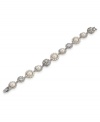 The perfect combination of elegance and grace. This frosty white bracelet by Carolee features glass crystal stones and glass pearls. Crafted in rhodium-plated mixed metal. Approximate length: 7-3/4 inches.