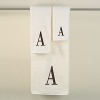 Monogram letter towels: A classic and sophisticated look, this monogrammed collection features a soft, plush oversized 100% combed cotton loop terry towel made of the finest quality materials. Choose from a white towel with a silver metallic embroidered letter of your choice in Bodoni font or an ivory towel with a brown embroidered letter of your choice in Bodoni font. All letters available A - Z.