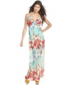 This halter maxi dress by Ali & Kris is made extra stylish with a colorful feather print through the whole silhouette. Wear with a wedge for outfit perfection!
