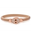 Subtle chic. Fossil's turn-lock bangle is crafted from rose gold-tone stainless steel with clear accents for a sparkling touch. Approximate diameter: 2-5/8 inch.