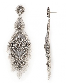 Intricately woven crystal, miyuki and silver rondelle beads illuminate long linear danglers from Miguel Ases. Pearl fringe adds movement and dimension. Intricately woven crystal, miyuki and silver rondelle beads illuminate long linear danglers from Miguel Ases. Pearl fringe adds movement and dimension.