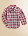 He'll look ultra-handsome in this classic plaid button-down shirt that's clearly too cool for school.Point collarLong sleeves with button cuffsButton-frontShirttail hemCottonMachine washImported Please note: Number of buttons may vary depending on size ordered. 