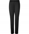 Jil Sanders black virgin wool pants are an artfully crafted example of elegant, precision tailoring - Medium-rise, slim cut style with a touch of stretch - Banded waist and side zip - Crease detail flatters and elongates the leg - Pant tapers and crops at ankles with a sleek vent - Polished and effortlessly chic, perfect for pairing with button downs or pullovers and ballet flats or pumps