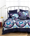 A vibrant and peppy palette melds with a deep navy hue in this Akala sham for a totally fresh and modern flair. An eclectic mix of florals, circles and swirls finishes this unique design.