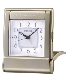 This elegant alarm clock from Seiko travels just as beautifully as it adorns any tabletop. Rectangular silvertone case. Square white dial with logo, numeral indices, alarm and snooze. Folds into a carrying case. Battery included. Measures approximately 3-3/8 x 2-5/8 x 1.