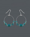 Snap up style that's fresh for summer. These bohemian-inspired wire hoop earrings by Avalonia Road feature turquoise nuggets and a sterling silver setting. Approximate drop: 2 inches.