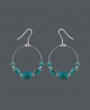 Snap up style that's fresh for summer. These bohemian-inspired wire hoop earrings by Avalonia Road feature turquoise nuggets and a sterling silver setting. Approximate drop: 2 inches.