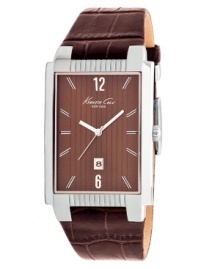Sophisticated details create the modern style of this dress watch by Kenneth Cole New York. Brown croc-embossed leather strap and rectangular stainless steel case. Brown dial features vertical stripes, silver tone numerals at twelve and six o'clock, stick indices, date window at six o'clock, three hands and logo. Quartz movement. Water resistant to 30 meters. Limited lifetime warranty. Sophisticated details create the modern style of this dress watch by Kenneth Cole New York. Brown croc-embossed leather strap and rectangular stainless steel case. Brown dial features vertical stripes, silver tone numerals at twelve and six o'clock, stick indices, date window at six o'clock, three hands and logo. Quartz movement. Water resistant to 30 meters. Limited lifetime warranty.