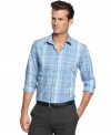 A lightweight plaid pattern captures modern cool and seasonal style with this poplin shirt from Calvin Klein.