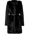 Wrap yourself up in trend-right luxe with this fur and leather combo coat - Round neck, long leather sleeves, slim fur body, front zip closure, belted waist - Pair with sleek trousers and a blouse, or a slinky cocktail sheath