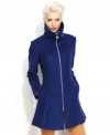 A flared silhouette and an edgy exposed zipper contrast so well with the traditional bouclé fabric of GUESS' chic coat!