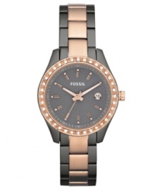 Surrounded by shimmering crystal accents, this elegant yet casual watch from Fossil brings a wonderful change-of-pace to your daily look. Surrounded by shimmering crystal accents, this elegant yet casual watch from Fossil brings a wonderful change-of-pace to your daily look.