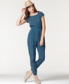 An on-trend casual look, this printed Bar III jumpsuit features a buttoned envelope-style back for an unexpected element!