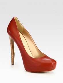 Ultra-high stacked heel adds a sultry touch to this traditional leather style. Stacked heel, 5 (125mm)Covered platform, 1 (25mm)Compares to a 4 heel (100mm)Leather upperLeather lining and solePadded insoleMade in Italy Ultra-high stacked heel adds a sultry touch to this traditional leather style. Stacked heel, 5 (125mm)Covered platform, 1 (25mm)Compares to a 4 heel (100mm)Leather upperLeather lining and solePadded insoleMade in Italy