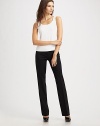 Sleek, fine-gauge stretch wool has pleated legs and classic 4-pocket styling.Midrise button-tab waistband Belt loops Zip-fly Inseam, about 34 98% wool/2% elastane Dry clean Imported