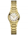 Golden glam, by GUESS. A ladylike silhouette adds fashion to this chic sport watch.