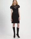 An ultra feminine look in lovely lace, with sweet puffed sleeves and a slip underneath.Jewel neckline Short puffed sleeves with scalloped edging Fitted bodice Seamed waist Slim skirt with scalloped hem Back zip closure Stretch slip lining About 38 from shoulder to hem 58% nylon/33% polyester/9% rayon Dry clean Imported