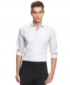 An ultra-slim fit for the modern man. Make sure to streamline your look with Calvin Klein's classic button front shirt
