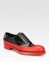 Lace-up style with dipped rubber design and exaggerated sole.Leather/rubber upperLeather liningRubber soleMade in Italy