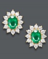 Frame your face with a glamorous, green glow. Effy Collection's regal looking stud earrings highlight oval-cut emeralds (2-1/4 ct. t.w.) and round-cut diamonds (1-3/8 ct. t.w.) set in 14k gold. Approximate drop length: 9/16 inch. Approximate drop width: 1/2 inch.