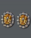 Sunshine-colored style will spice up your look year round! Effy Collection's oval-cut citrine studs (1-3/8 ct. t.w.) are encircled by round-cut champagne diamonds (1/5 ct. t.w.). Crafted in 14k gold. Approximate diameter: 1/3 inch.