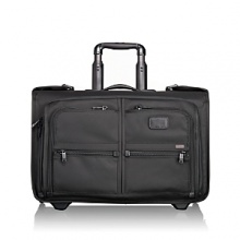 Simplify and streamline shorter business trips with this compact wheeled garment bag. Designed to fit in the overhead compartment, this bag holds a suit or dress and has numerous pockets for folded clothes and accessories, and removable zippered pouches. The exterior has a large zip pocket plus two U-zip pockets for shoes or a travel kit, and features a telescoping handle, two-wheel system and top carry handle. Simplify and streamline shorter business trips with this compact wheeled garment bag. Designed to fit in the overhead compartment, this bag holds a suit or dress and has numerous pockets for folded clothes and accessories, and removable zippered pouches. The exterior has a large zip pocket plus two U-zip pockets for shoes or a travel kit, and features a telescoping handle, two-wheel system and top carry handle.