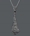It's a black tie affair. Glam it up in Kaleidoscope's tie-shaped smokey crystal pendant. Crafted in sterling silver with Swarovski elements. Approximate length: 18 inches. Approximate drop: 1-5/8 inches.