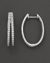 Diamonds set in 14K. white gold hoops.