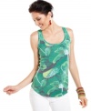 Made in the shade: The palm fronds print of this Calvin Klein Jeans tank top offers a touch of cool to summer days. Pair it with white denim for a right-now ensemble!