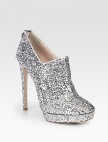 This glitter-coated platform design drips with style, featuring a sky-high heel and metallic leather trim. Self-covered heel, 5¼ (130mm)Covered platform, 1 (25mm)Compares to a 4¼ heel (110mm)Glitter-coated upper with metallic leather trimBack zipLeather lining and solePadded insoleMade in Italy