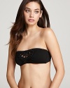 Macrame detailing adds a handmade, bohemian vibe to Betsey Johnson's beyond-basic black bikini. Add some high-end hippie accessories for one of a kind, jet set style.