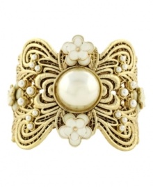 Lovely in lace. Jessica Simpson's intricate cuff bracelet combines elegance with a vintage aesthetic. Crafted in gold tone mixed metal with pretty simulated pearls and ivory resin flowers. Approximate diameter: 2-1/2 inches. Lovely in lace. Jessica Simpson's intricate cuff bracelet combines elegance with a vintage aesthetic. Crafted in gold tone mixed metal with pretty simulated pearls and ivory resin flowers. Approximate diameter: 2-1/2 inches.
