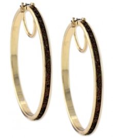 Hit the right notes with these hoop earrings from Jessica Simpson. Crafted from gold tone mixed metal, they also shine with a topaz-colored glitter. Approximate drop: 2-1/2 inches. Approximate diameter: 2-1/2 inches. Hit the right notes with these hoop earrings from Jessica Simpson. Crafted from gold tone mixed metal, they also shine with a topaz-colored glitter. Approximate drop: 2-1/2 inches. Approximate diameter: 2-1/2 inches.
