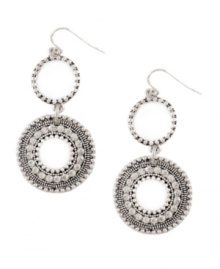 Take hippie-chic to a whole new level. These bohemian-style earrings by Jessica Simpson feature artfully-crafted double disc drops in worn silver tone mixed metal. Approximate drop: 3 inches. Take hippie-chic to a whole new level. These bohemian-style earrings by Jessica Simpson feature artfully-crafted double disc drops in worn silver tone mixed metal. Approximate drop: 3 inches.