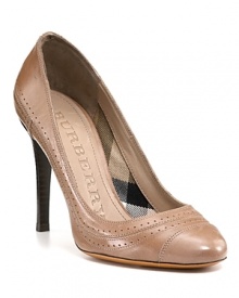 It's all in the details on the Burberry Stawell pump--a lightly glazed leather offers a sleek look, while perforated details lend a smart finish. It's all in the details on the Burberry Stawell pump--a lightly glazed leather offers a sleek look, while perforated details lend a smart finish.