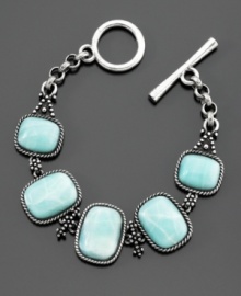 A beautiful boho-chic bracelet from Lucky Brand featuring five blue stones with vintage-inspired silvertone details. Peace sign and flower design on back. Toggle clasp. Length measures 7-1/2 inches. A beautiful boho-chic bracelet from Lucky Brand featuring five blue stones with vintage-inspired silvertone details. Peace sign and flower design on back. Toggle clasp. Length measures 7-1/2 inches.