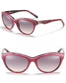 Western-inspired cat eye sunglasses with contrast leopard interior and studded sides. Western-inspired cat eye sunglasses with contrast leopard interior and studded sides.