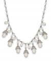 Lauren by Ralph Lauren goes for classic cool with this necklace. Crafted from silver tone brass, the link necklace features an array of glass pearls for an elegant touch. Approximate length: 18 inches. Approximate drop: 1/2 inch.