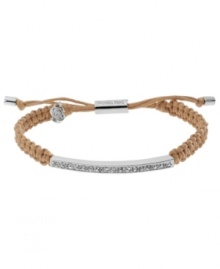 A natural wonder. Michael Kors' chic macrame bracelet features woven natural-tone cotton cord with a silver tone mixed metal bar, accented with glistening pave glass stones. Clasp and logo charms crafted in silver tone mixed metal. Approximate diameter: 2 to 2-3/4 inches. Bracelet adjusts to fit wrist. A natural wonder. Michael Kors' chic macrame bracelet features woven natural-tone cotton cord with a silver tone mixed metal bar, accented with glistening pave glass stones. Clasp and logo charms crafted in silver tone mixed metal. Approximate diameter: 2 to 2-3/4 inches. Bracelet adjusts to fit wrist.
