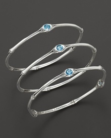 From the Batu Bamboo collection, a set of three slim bamboo bangles with blue topaz accents. Designed by John Hardy From the Batu Bamboo collection, a set of three slim bamboo bangles with blue topaz accents. Designed by John Hardy
