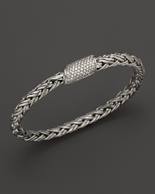 Diamonds glitter from the clasp of a sterling silver bracelet, part of the John Hardy Classic Chain Kepang collection. Diamonds glitter from the clasp of a sterling silver bracelet, part of the John Hardy Classic Chain Kepang collection.