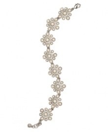 Pretty petals. A delicate floral motif defines this lovely flex bracelet from Monet. Crafted in silver tone mixed metal, it's embellished with imitation pearls as well as sparkling crystals and glass accents. Approximate length: 7-1/2 inches. Pretty petals. A delicate floral motif defines this lovely flex bracelet from Monet. Crafted in silver tone mixed metal, it's embellished with imitation pearls as well as sparkling crystals and glass accents. Approximate length: 7-1/2 inches.