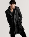 An undisputed classic from Burberry Brit, the double-breasted trench coat brings understated style to blustery days.